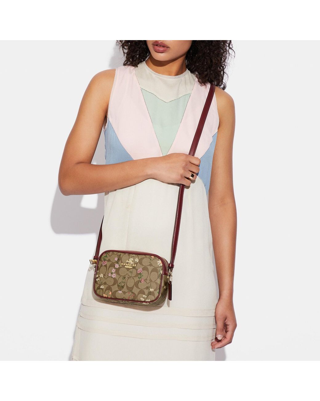 Coach sadie crossbody deals in signature canvas