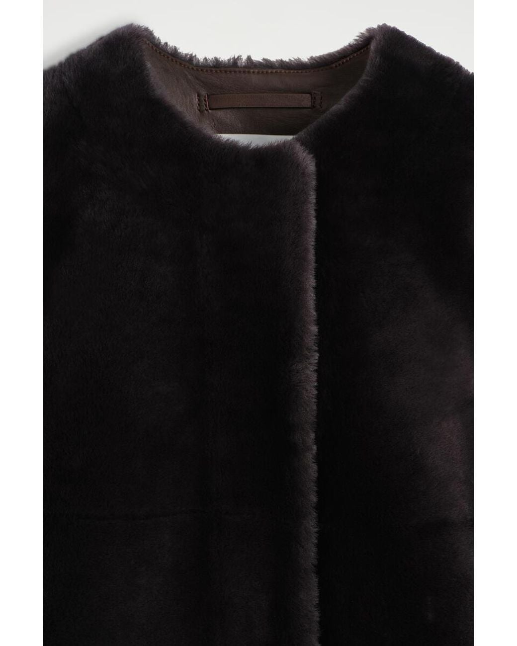 COS Black Collarless Shearling Coat