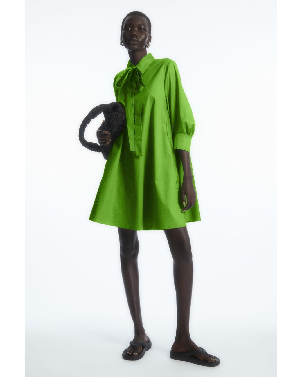https://cdna.lystit.com/1040/1300/n/photos/cosstores/c2ea79da/cos-Green-Bow-Mini-Shirt-Dress.jpeg