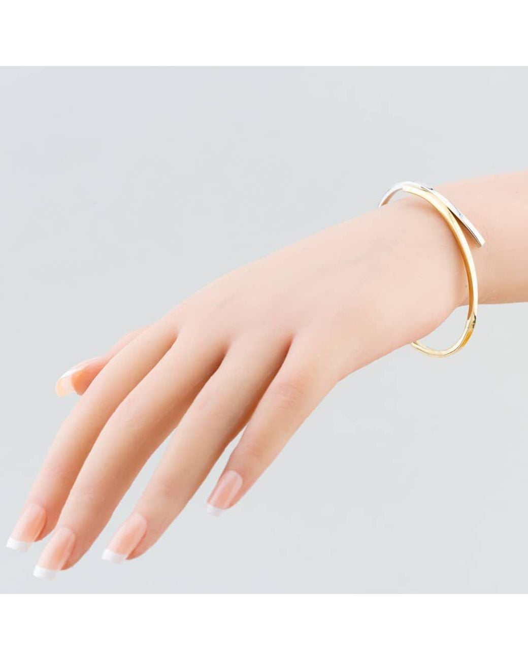 T.H.Baker Metallic 9Ct Two Colour Crossover Bangle Bn488