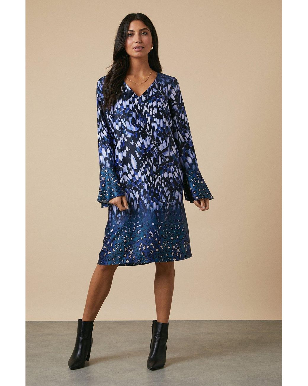 Leopard print dress shop with blue butterflies