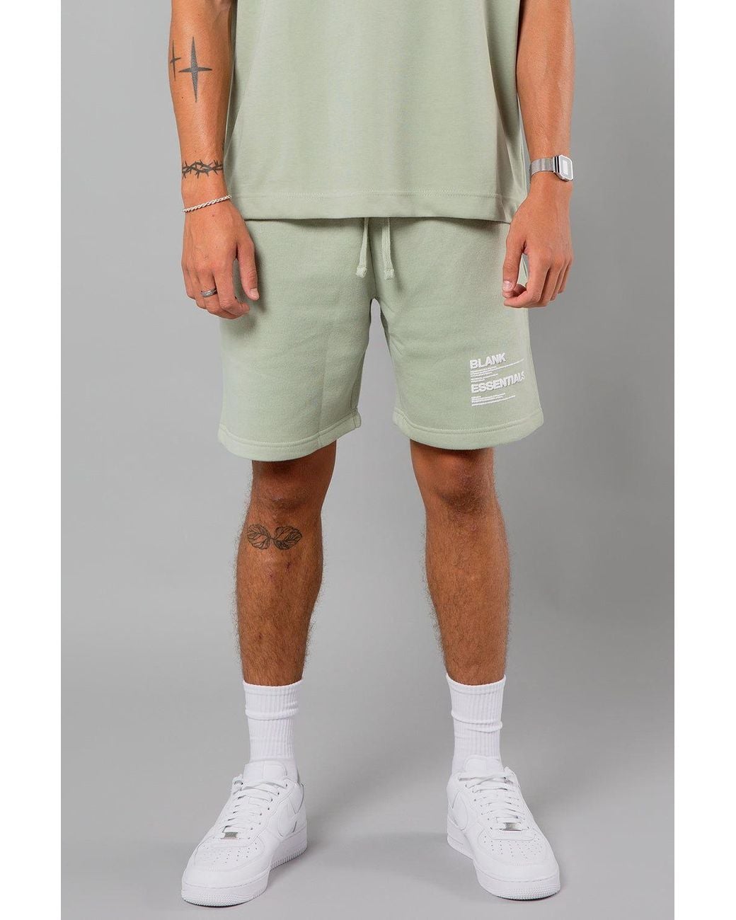 Blank Essentials Green Cotton Blend Shorts With Graphic Print for men