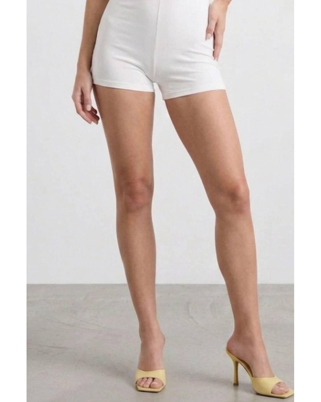 Stylewise White Open Back Halter Neck Plunge Neckline Playsuit
