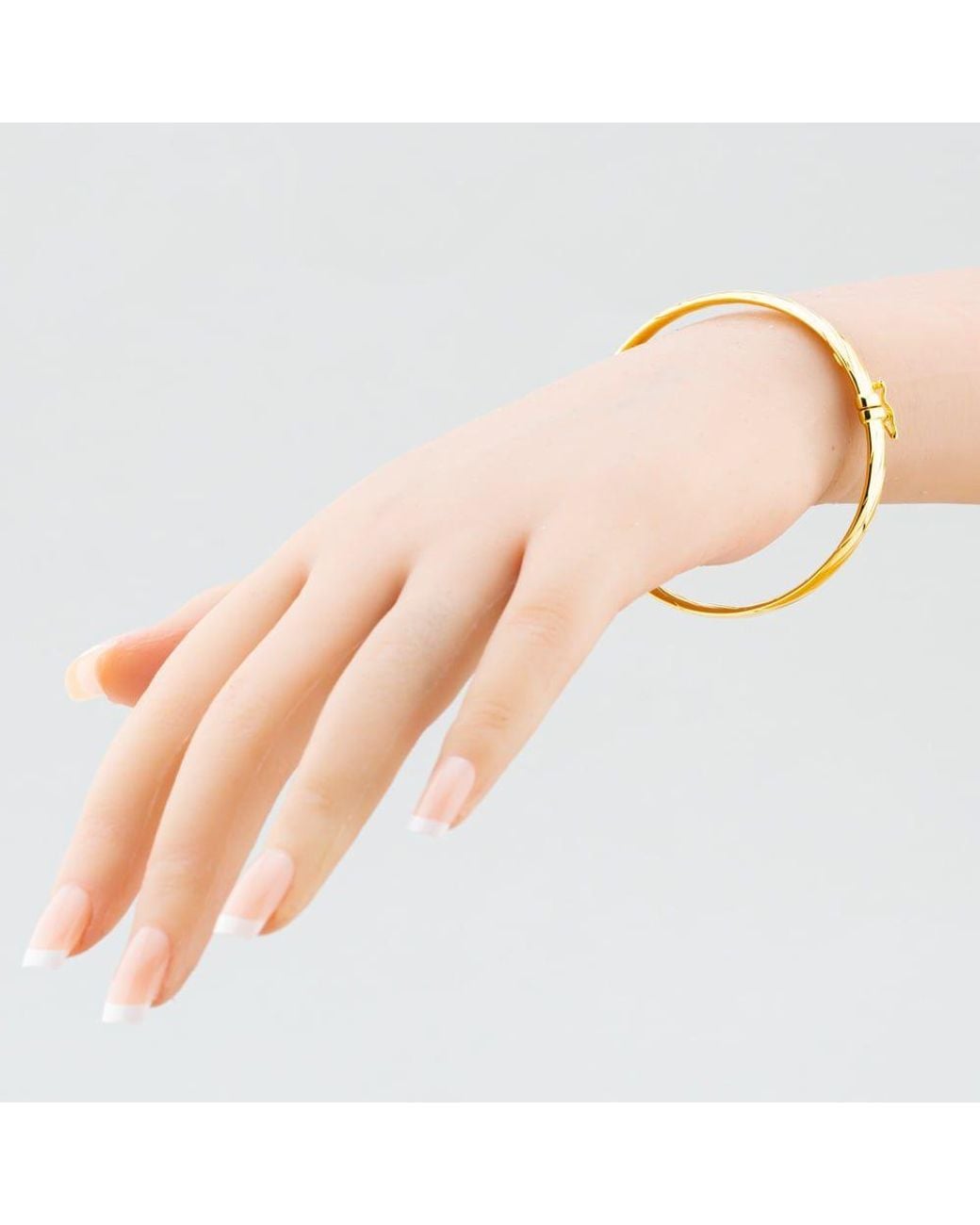 T.H.Baker Metallic 9Ct Twist Bangle 1340521