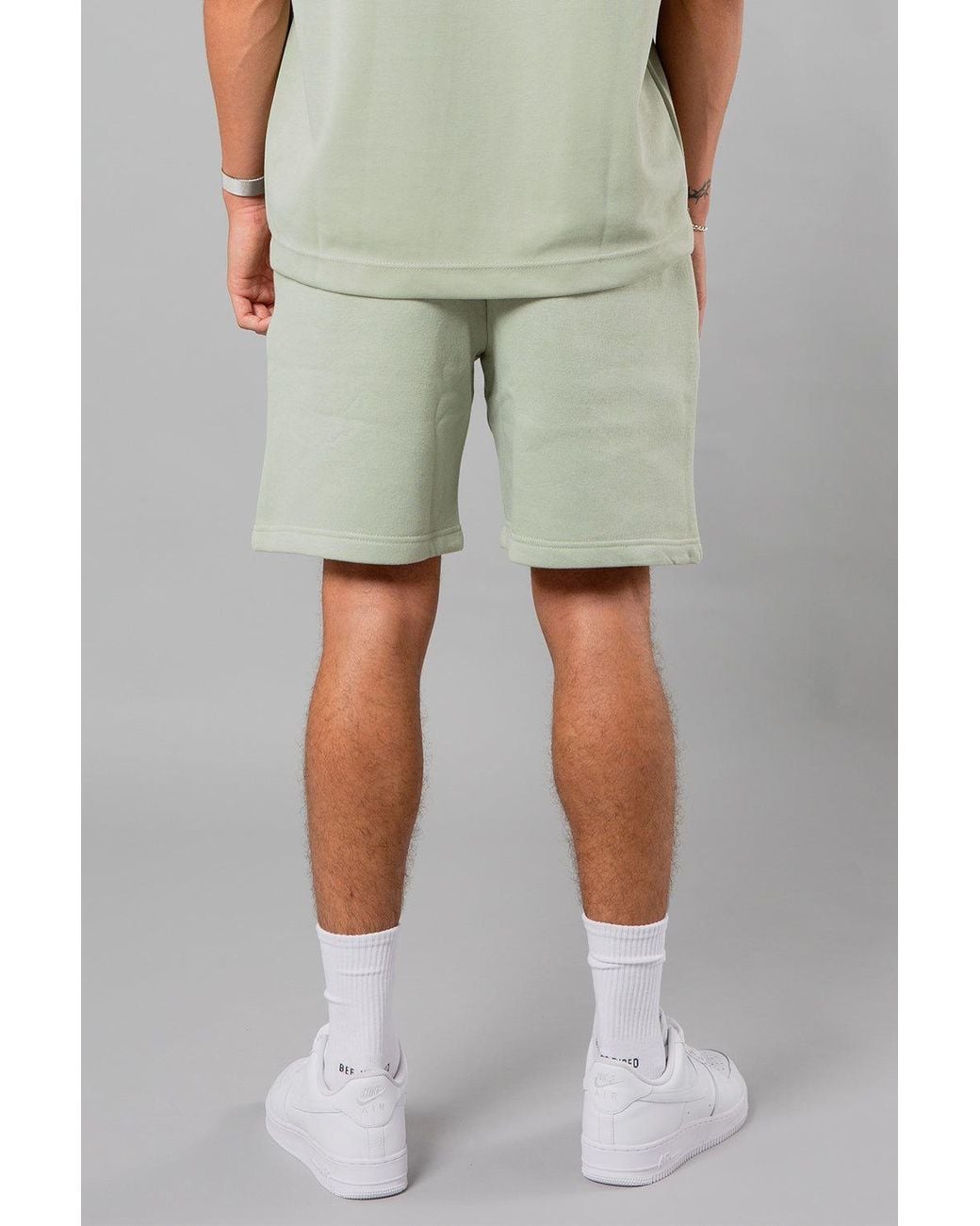 Blank Essentials Green Cotton Blend Shorts With Graphic Print for men