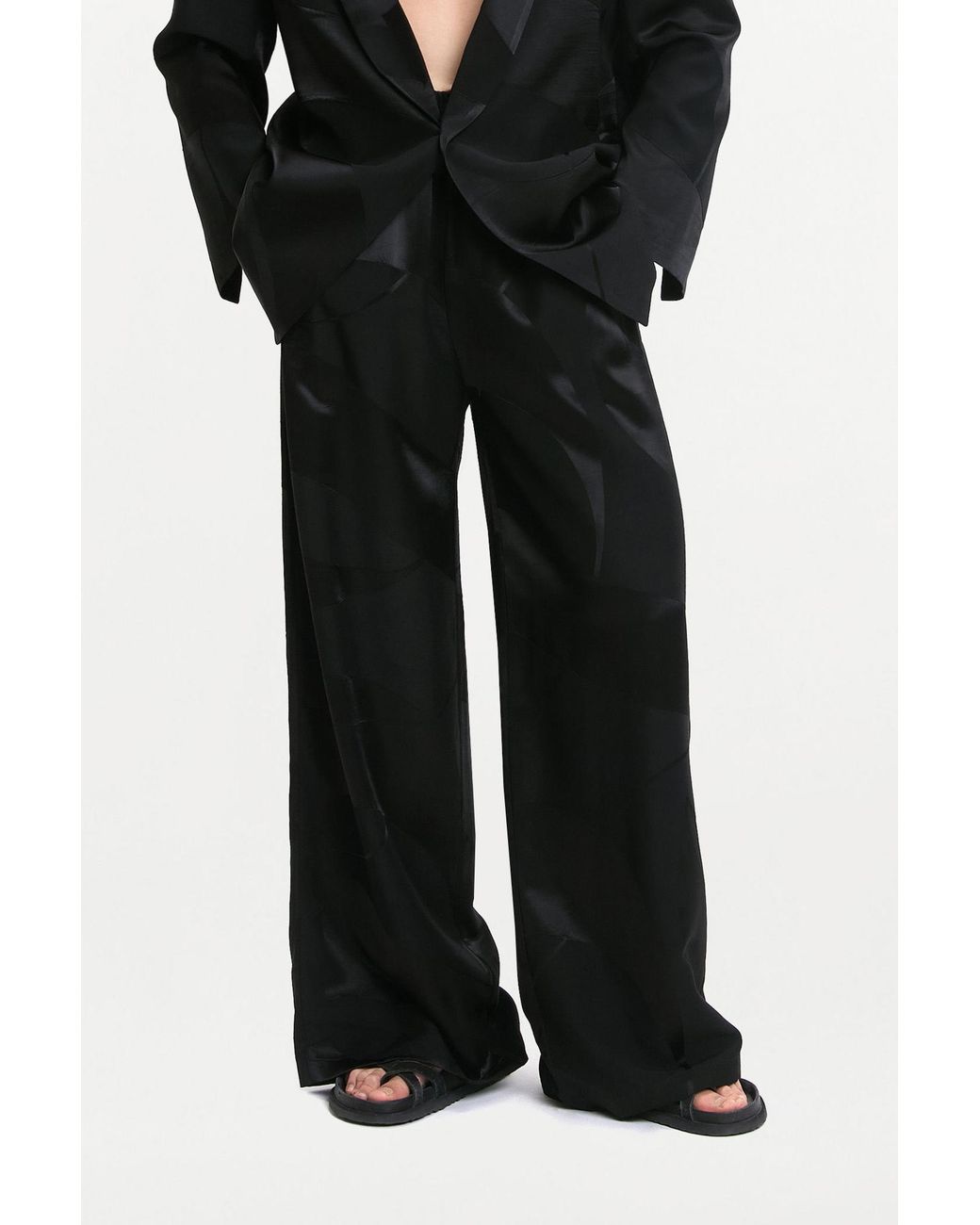 delos.land Black Clement Trousers Monogram for men