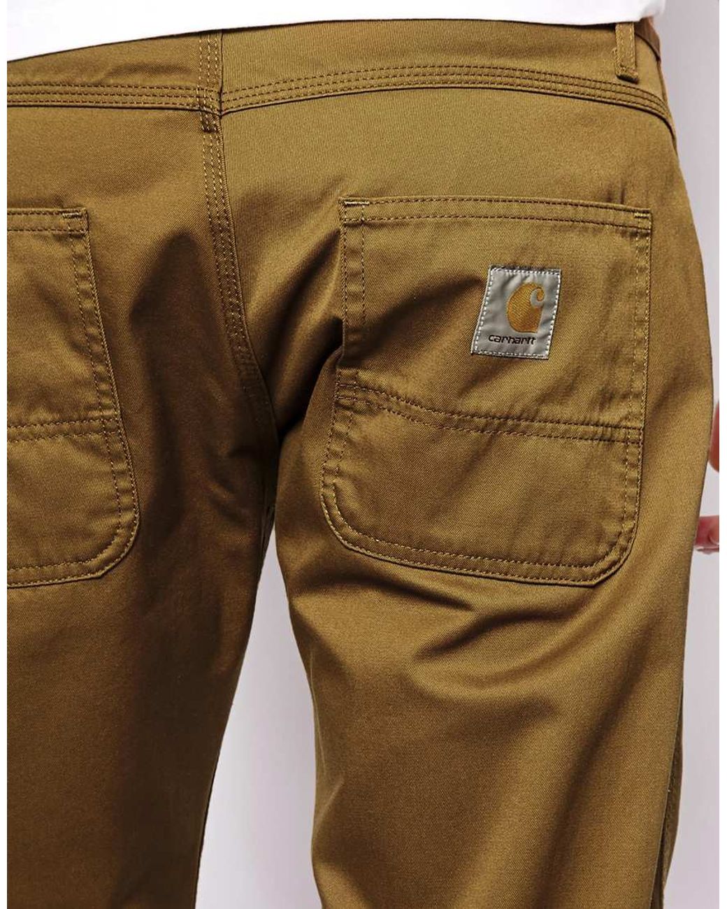 https://cdna.lystit.com/1040/1300/n/photos/e0cd-2014/04/02/carhartt-brown-skill-pant-slim-fit-casual-pants-product-1-18870158-0-524494566-normal.jpeg
