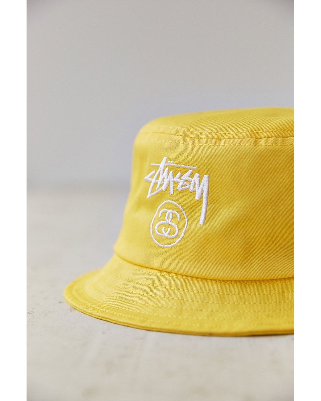 yellow stussy bucket hat