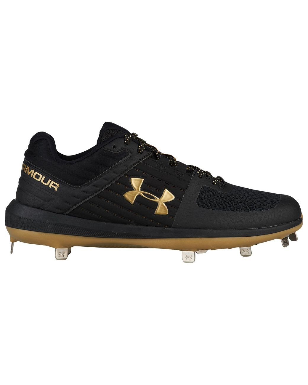 gold and black under armour cleats