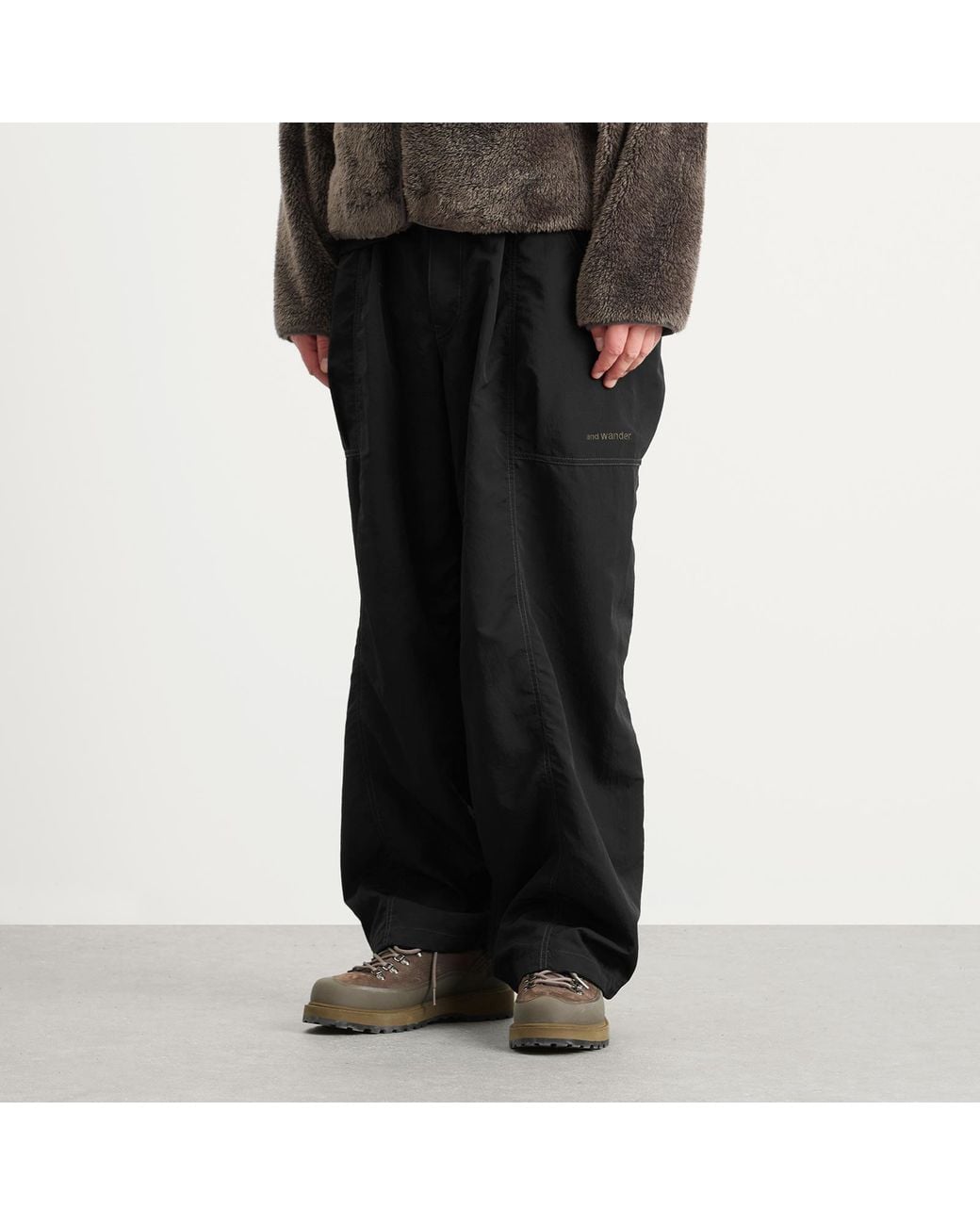 And Wander Black Crinkled Nylon Trousers for men