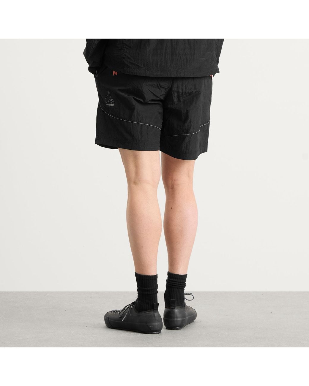 And Wander Black X Roa Ripstop Wind Shorts for men