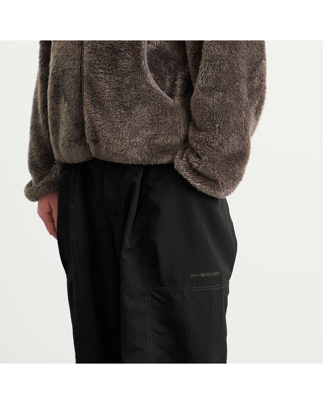 And Wander Black Crinkled Nylon Trousers for men