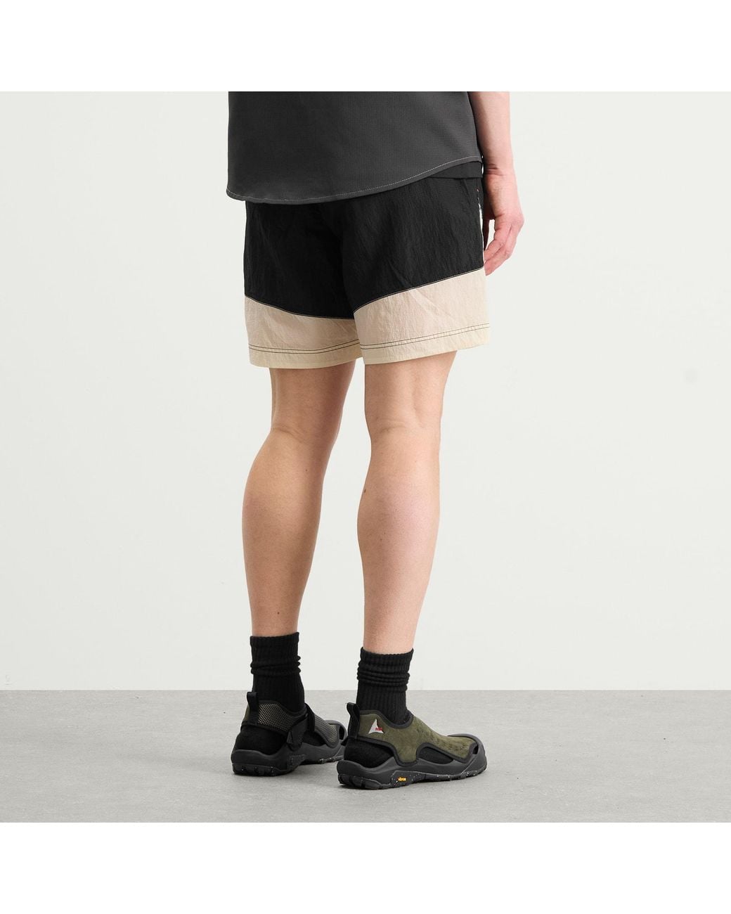 And Wander Black X Roa Ripstop Wind Shorts for men
