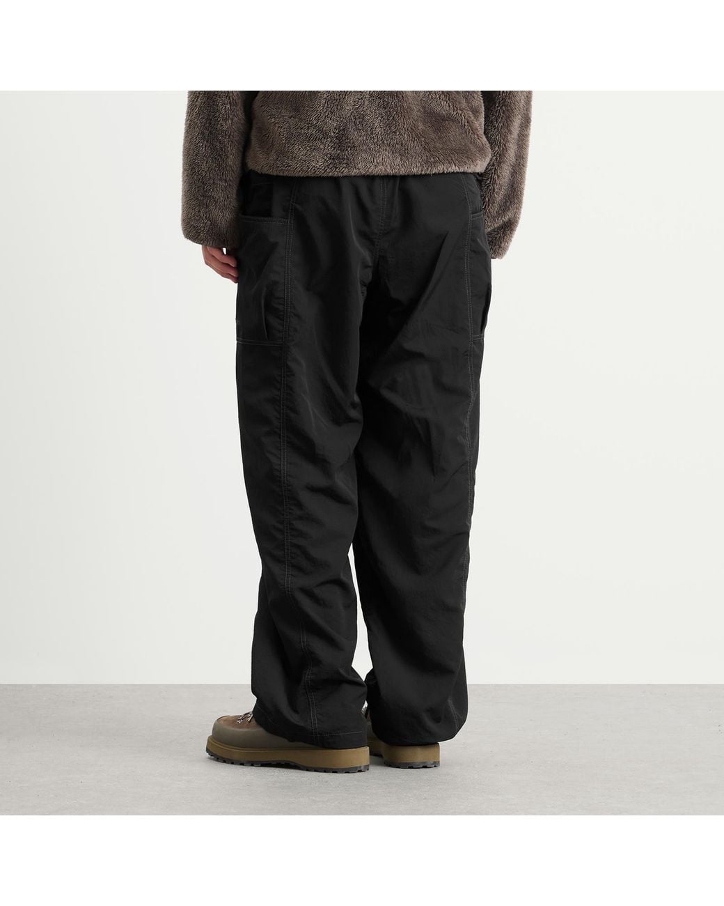 And Wander Black Crinkled Nylon Trousers for men