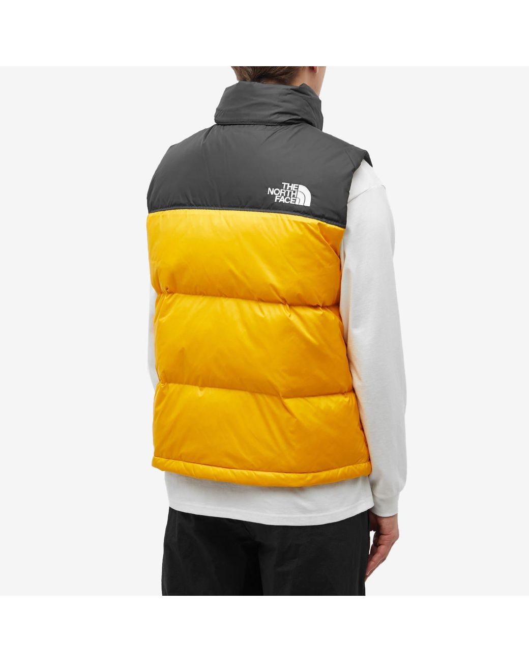 Gold north face vest deals