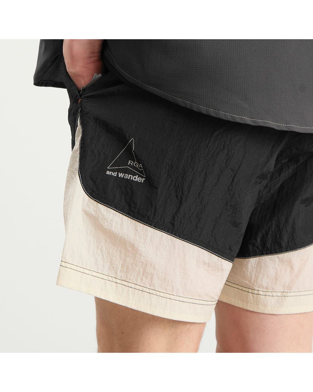 And Wander Black X Roa Ripstop Wind Shorts for men