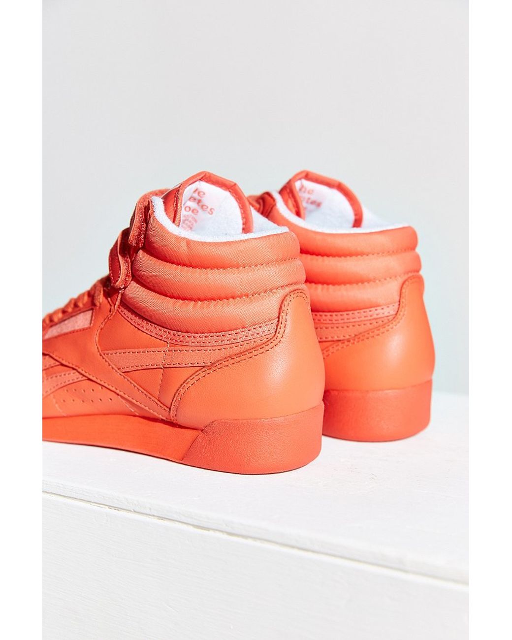Reebok Freestyle Hi Spirit Sneaker in Orange | Lyst