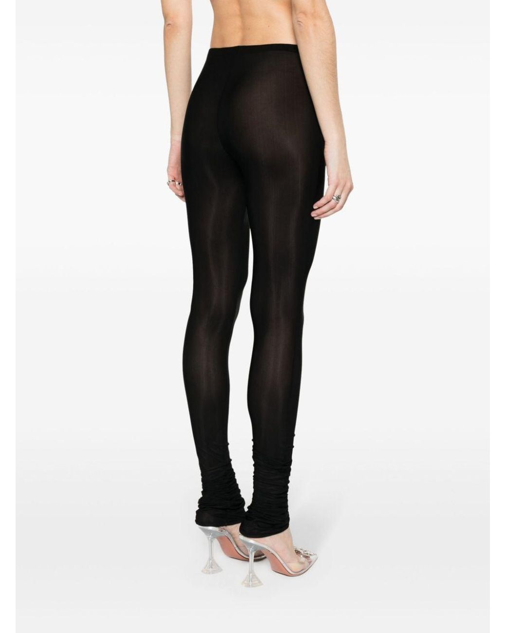 https://cdna.lystit.com/1040/1300/n/photos/farfetch/04ac677d/blumarine-black-Leggings-semi-trasparenti.jpeg