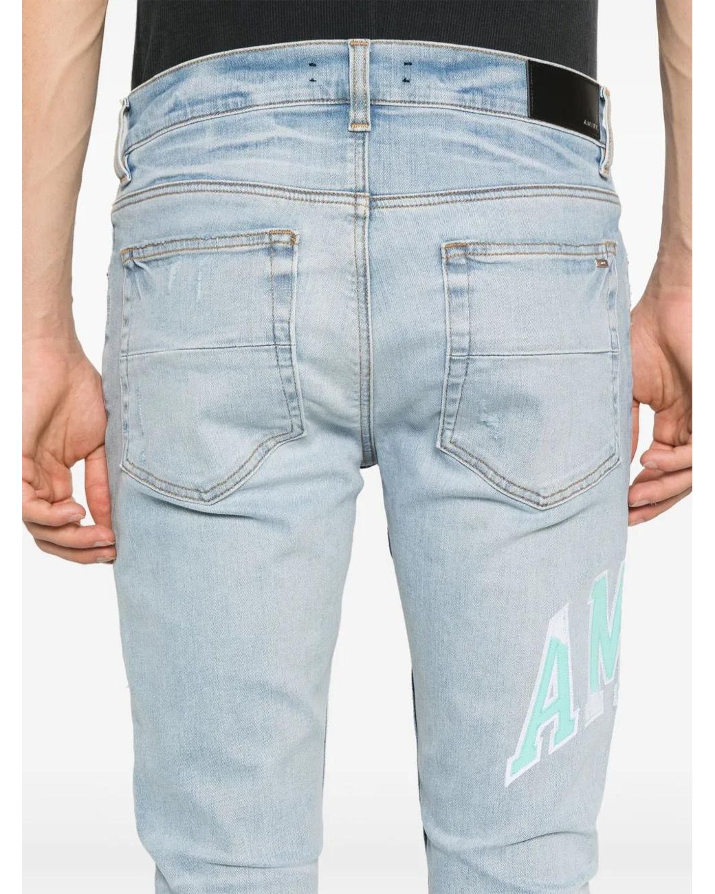 Amiri Blue Varsity Logo Skinny Jeans for men