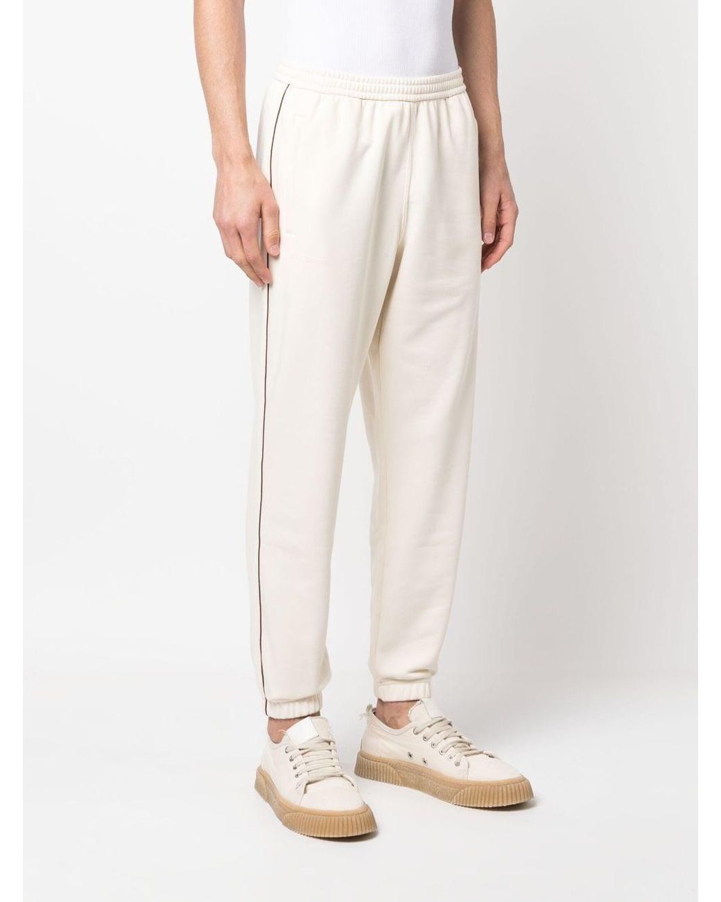 Pantalones de chándal ajustados a rayas de adidas de color Blanco | Lyst