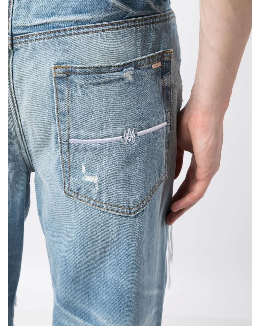 Amiri Blue Loose-fit Jeans In Destroyed Denim for men