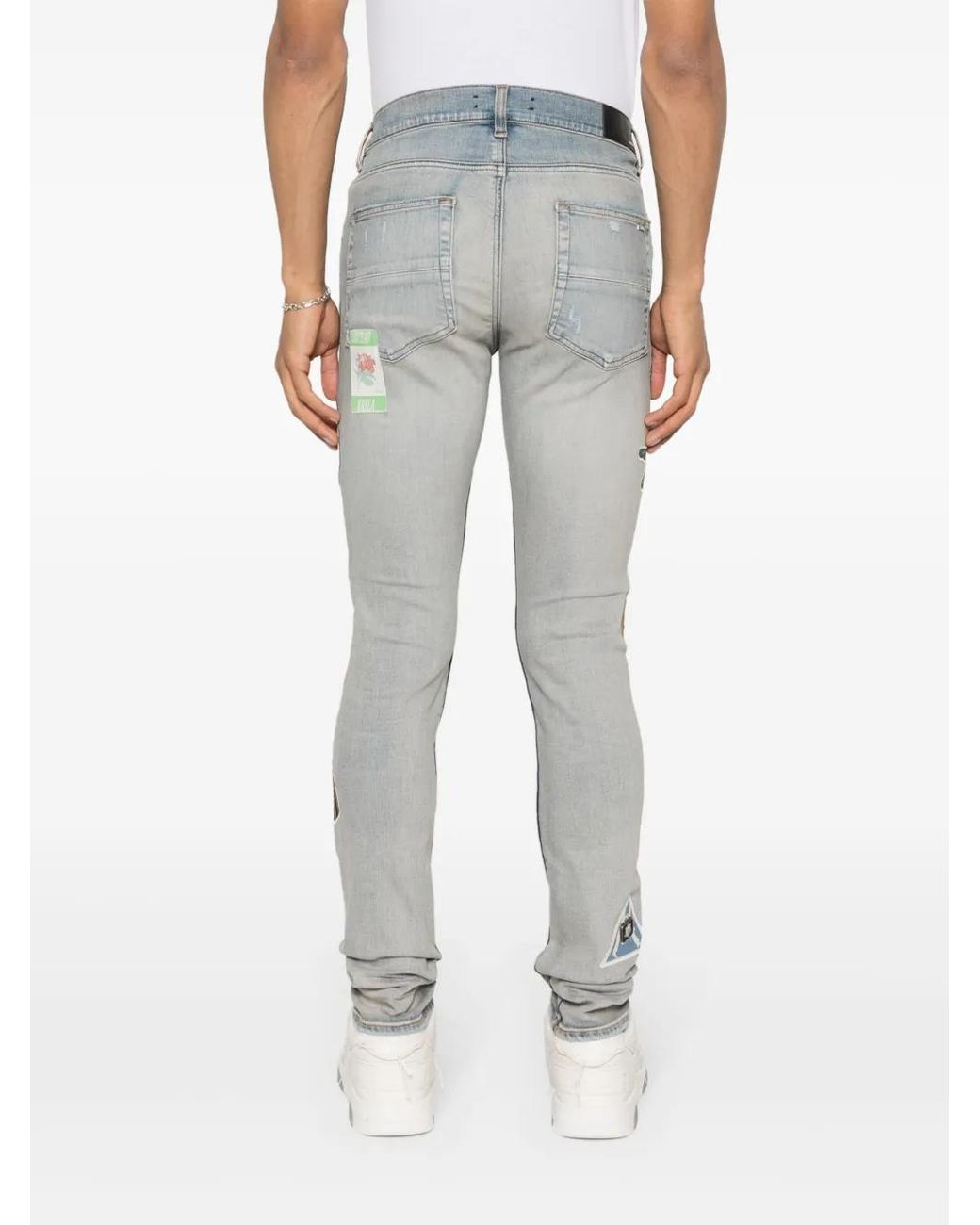 Amiri Blue Travel Patch Repair Skinny Jeans for men
