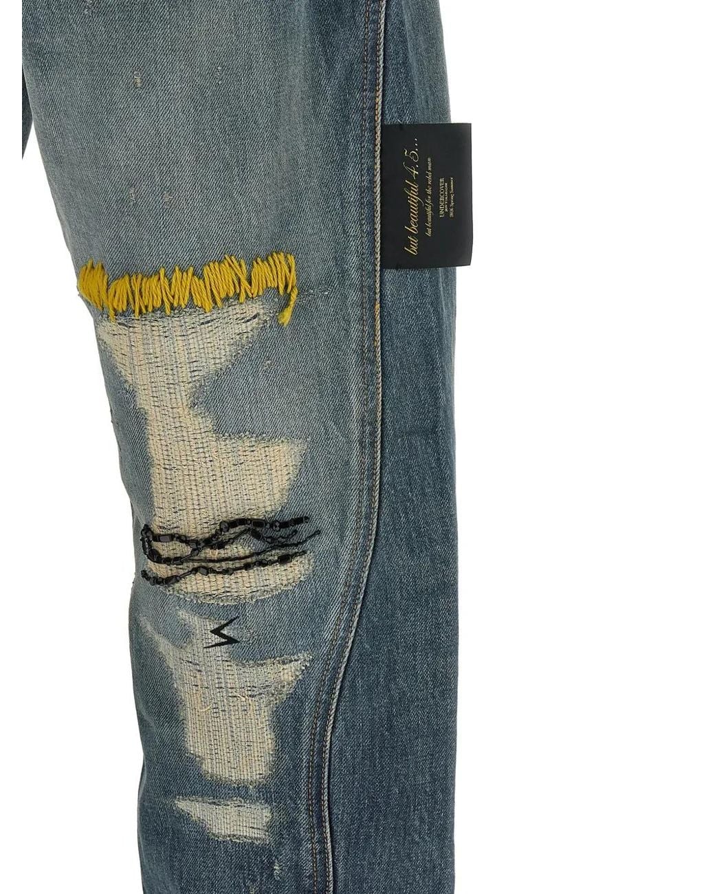 Undercover Blue Embroidered Distressed Jeans for men
