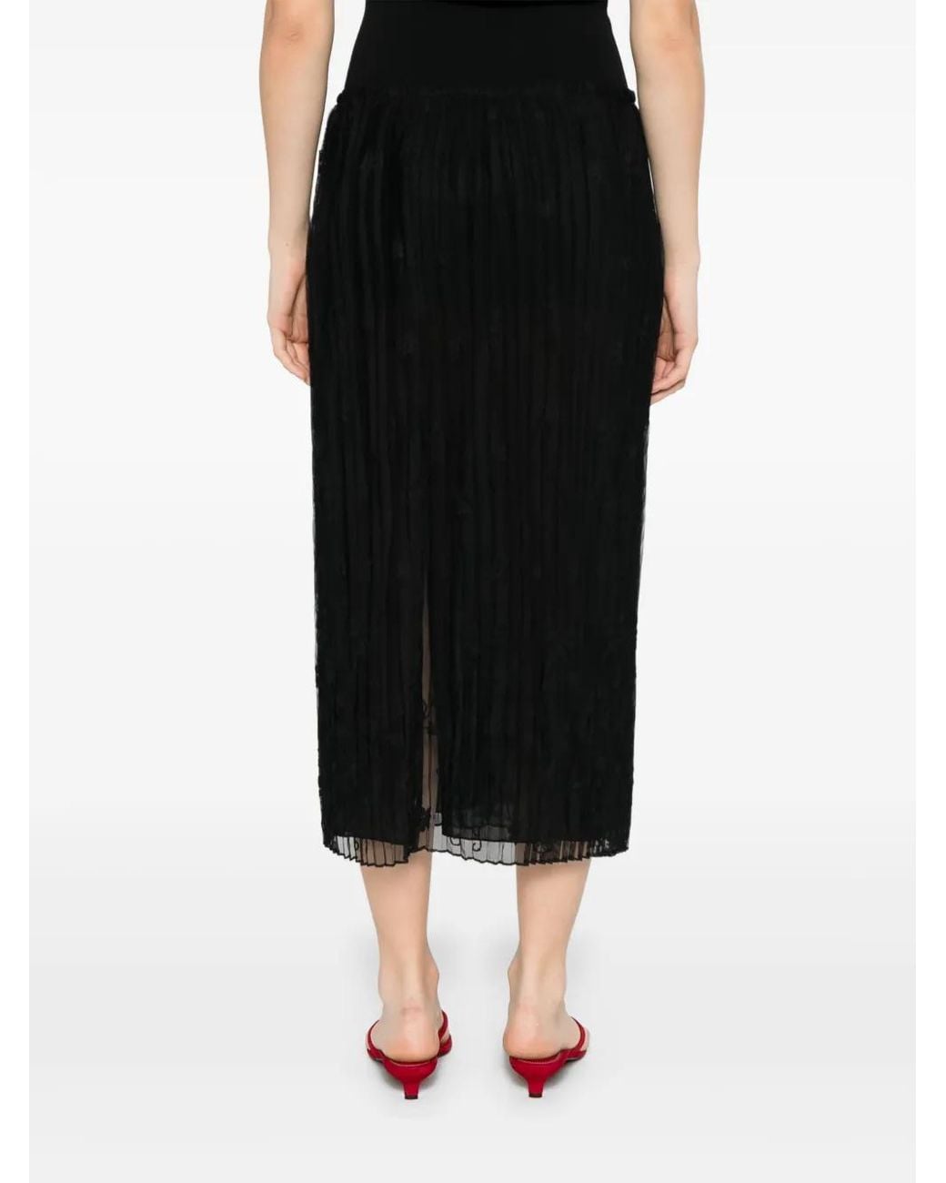 Falda acampanada con bordado floral Totême de color Black