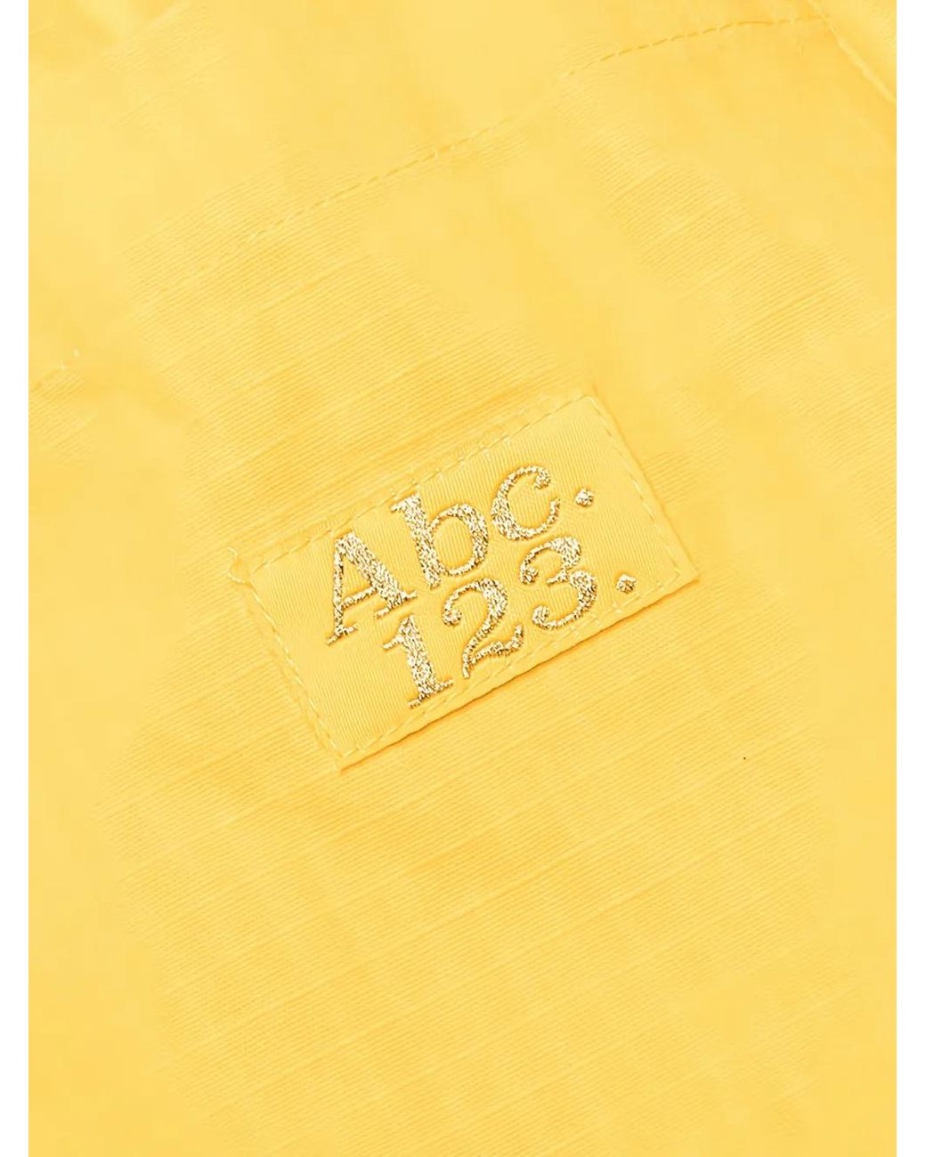 Advisory Board Crystals Yellow Logo-Patch Trousers for men