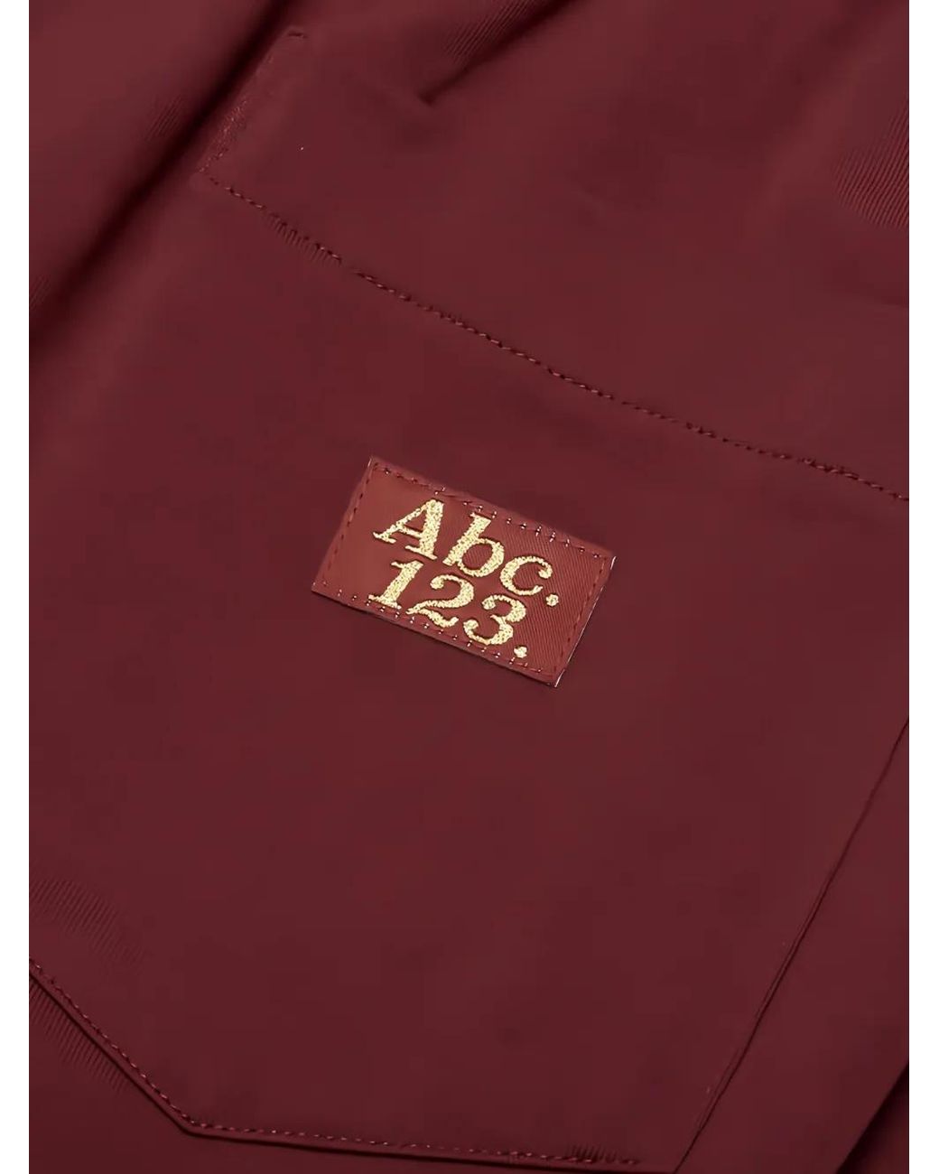 Advisory Board Crystals Red Logo-Patch Trousers for men