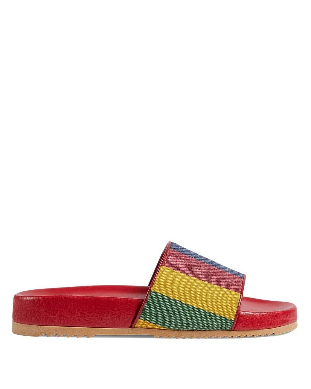 tan and red gucci slides