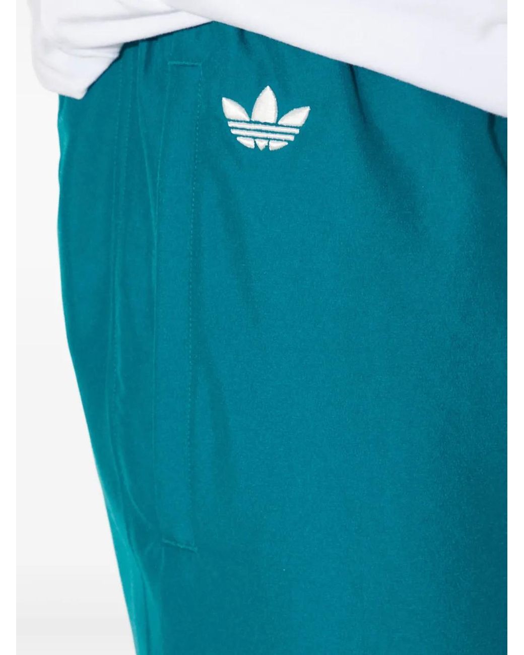 Adidas Blue Three-Stripe Track Pants for men