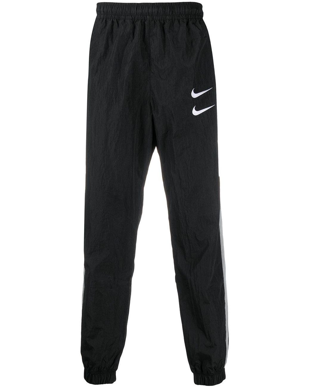Pantalones de chándal con doble logo Swoosh Nike de hombre de color Negro |  Lyst