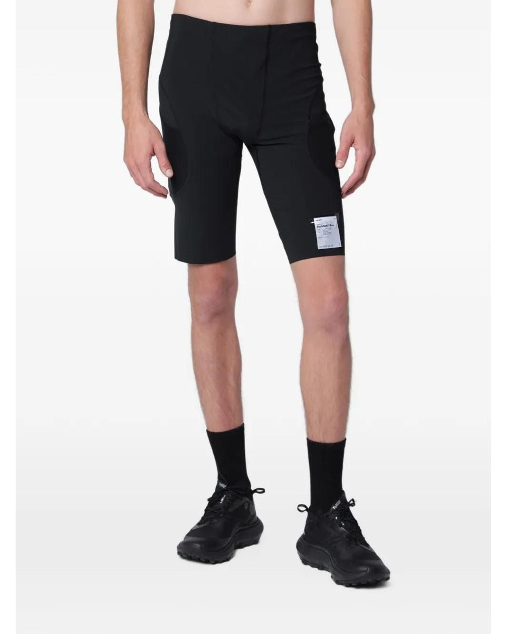 Satisfy Black Logo-Patch Panelled Shorts for men