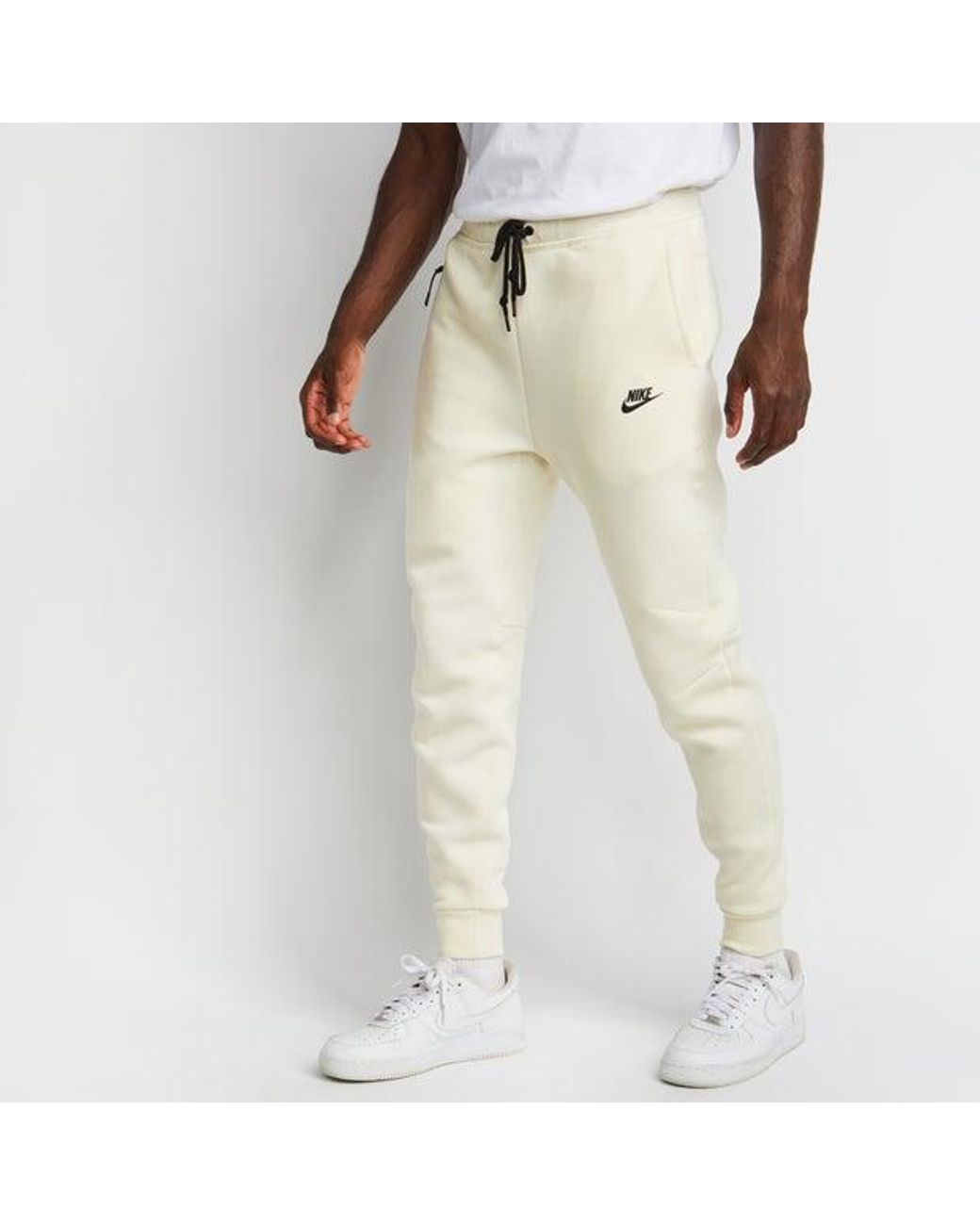 nike tech beige pants