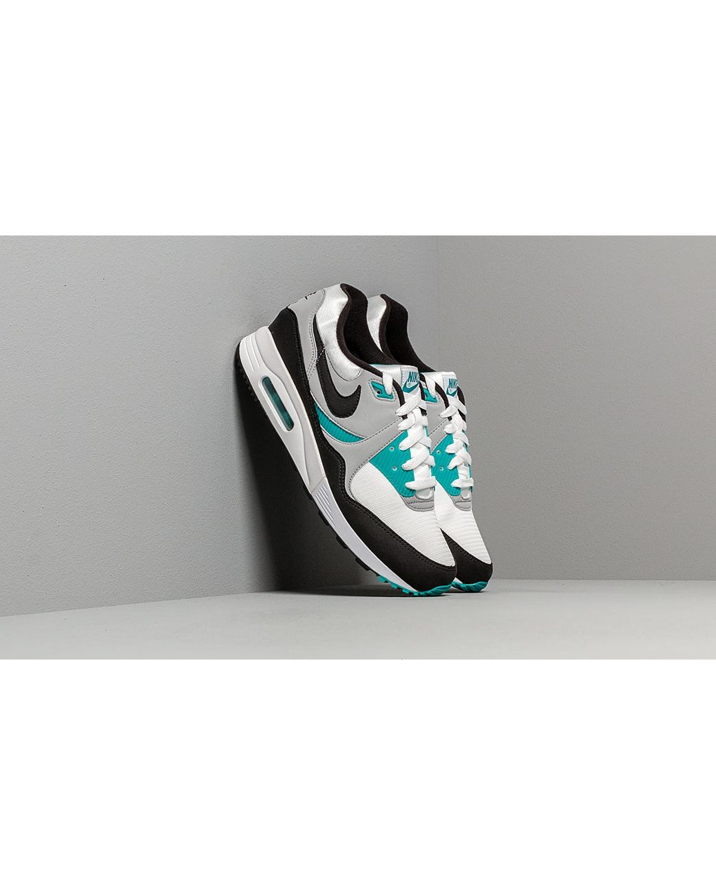 teal black and white nike shoes