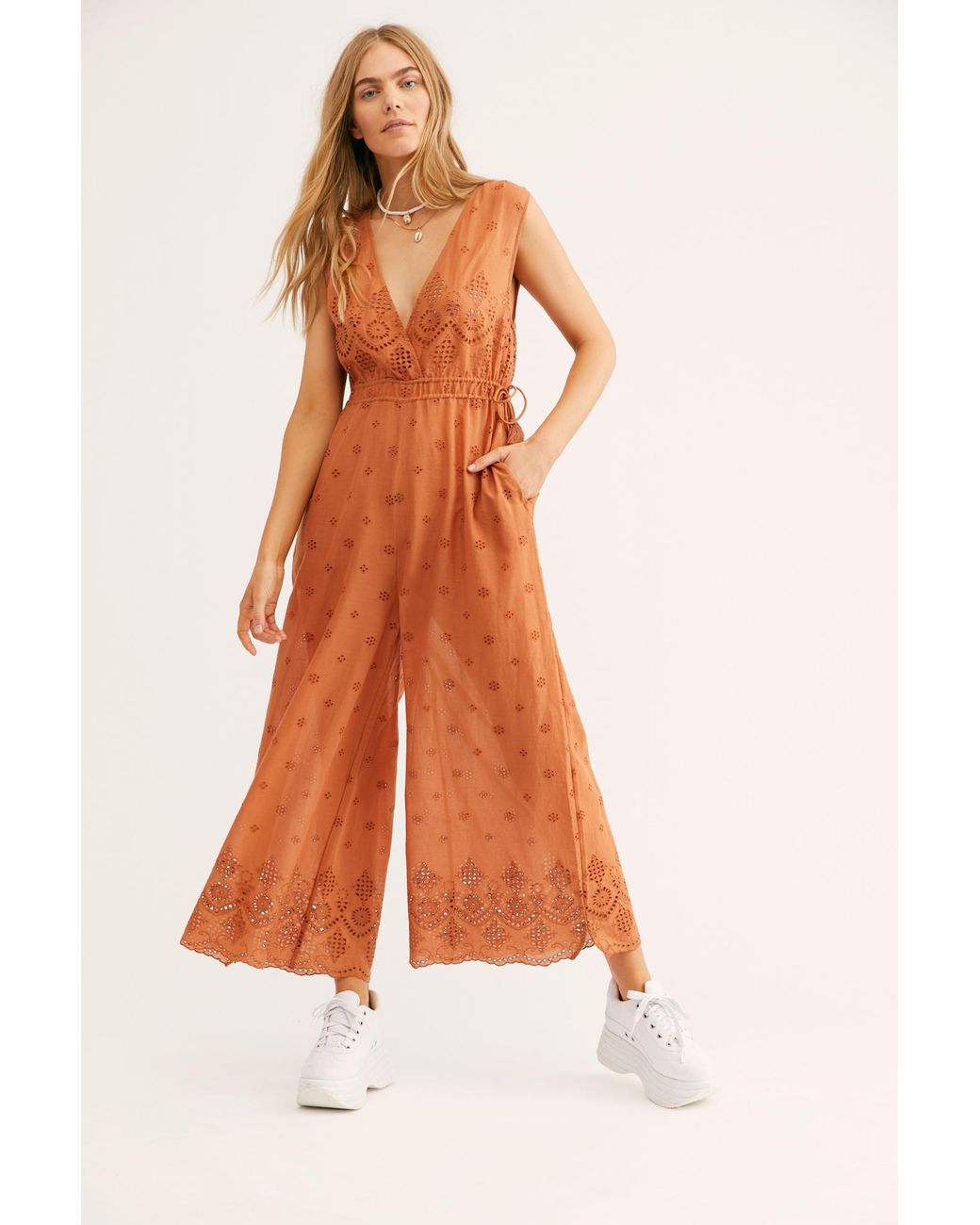Free people hotsell orange jumpsuit