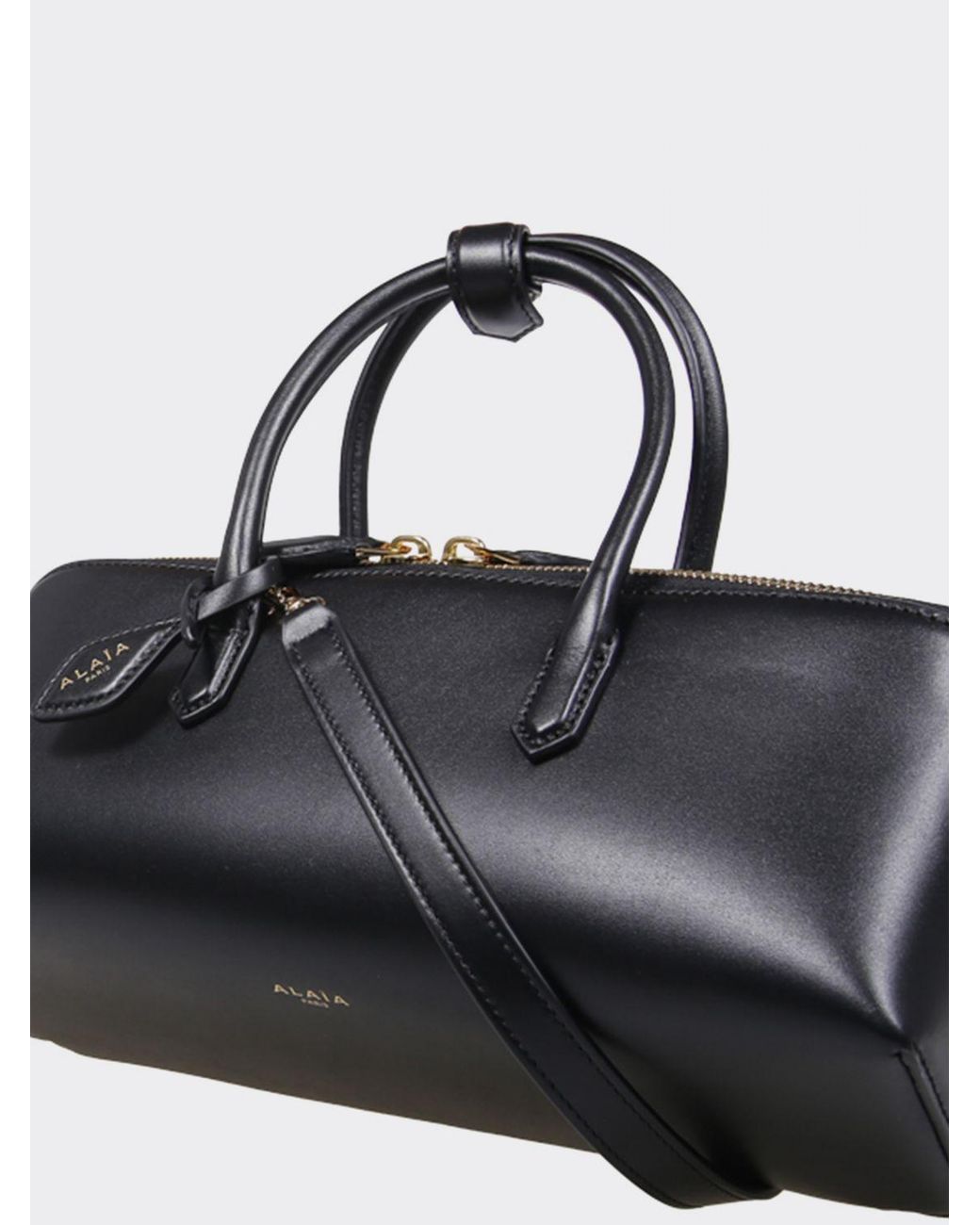 Alaïa Black Small Leather Handbag With Double Tubular Handle And Logo Charm