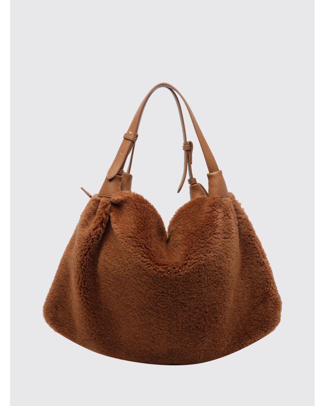 La Carrie Brown Shearling Shoulder Bag With Double Adjustable Handle And Tassels