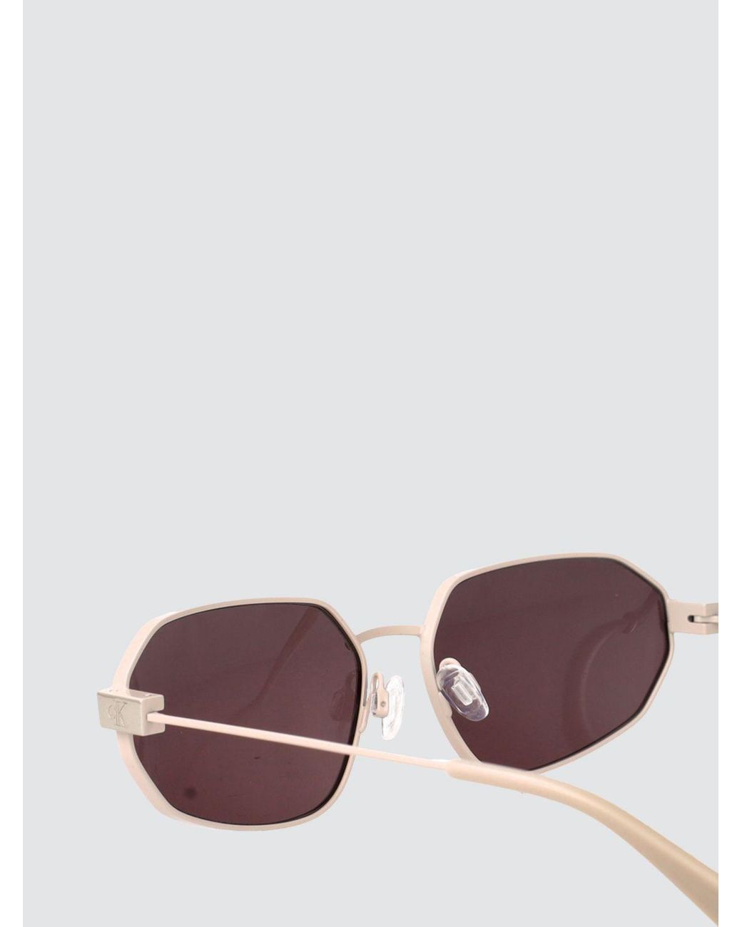 Calvin Klein Metallic Oval Metal Sunglasses With Engraved Logo for men