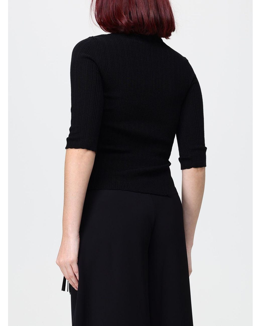 SIMONA CORSELLINI Black Ribbed Wool Short-Sleeved Turtleneck With Fringes