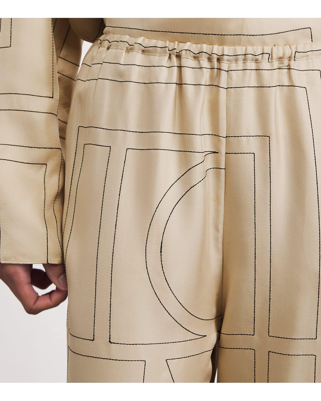 Totême Natural Silk Monogram Trousers