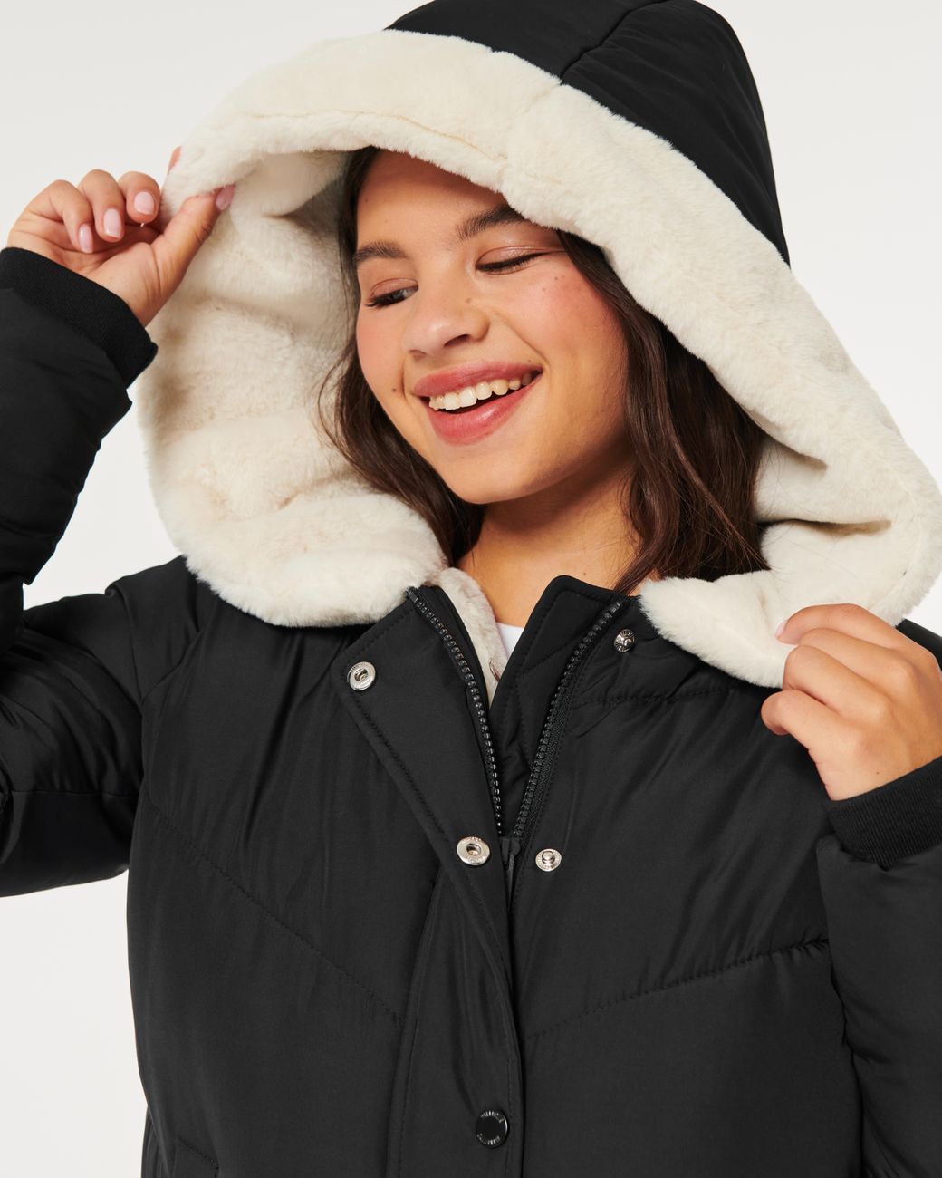 Black coat with white fur hood 2025