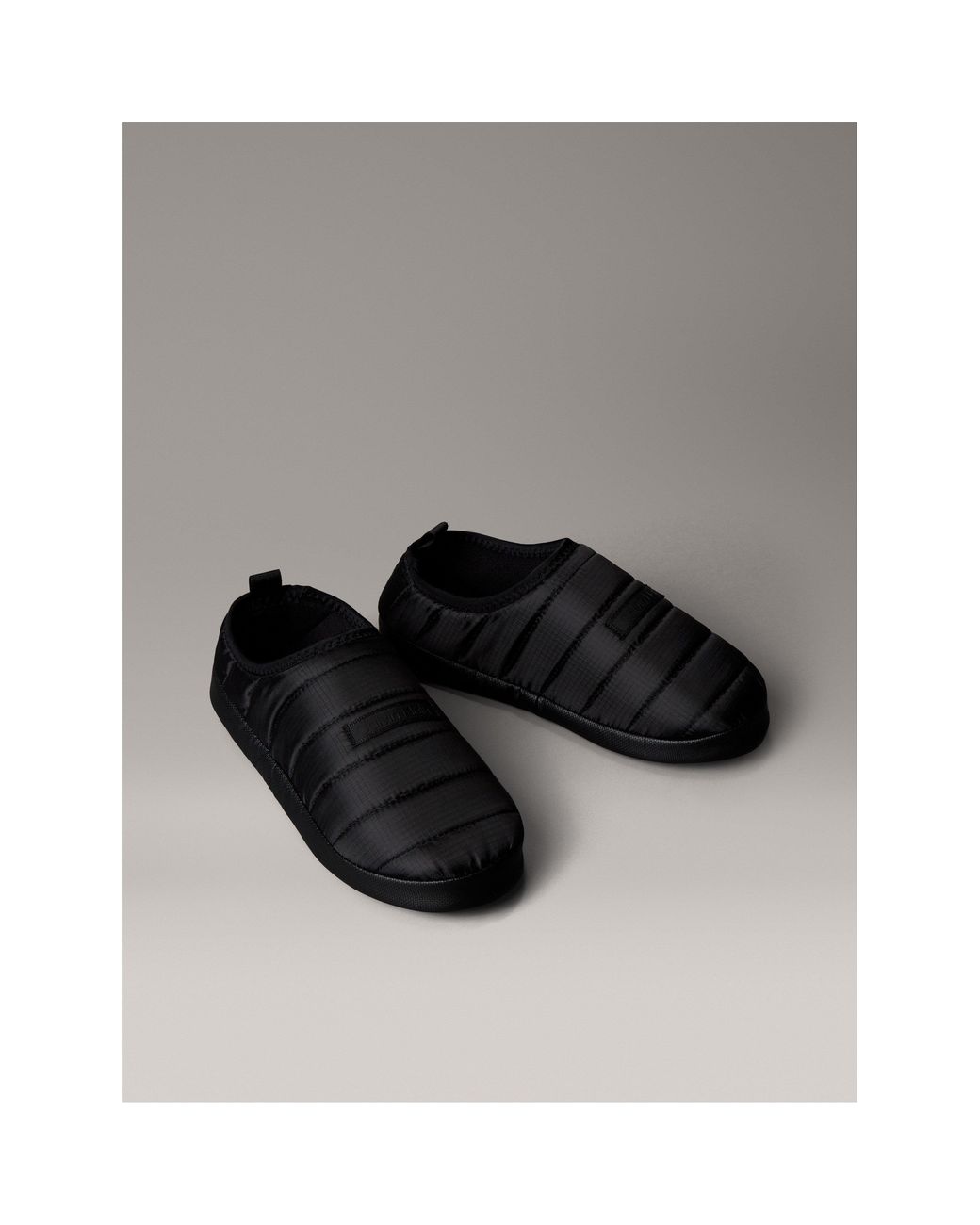 Calvin Klein Black Puffer Moccasin Slippers for men