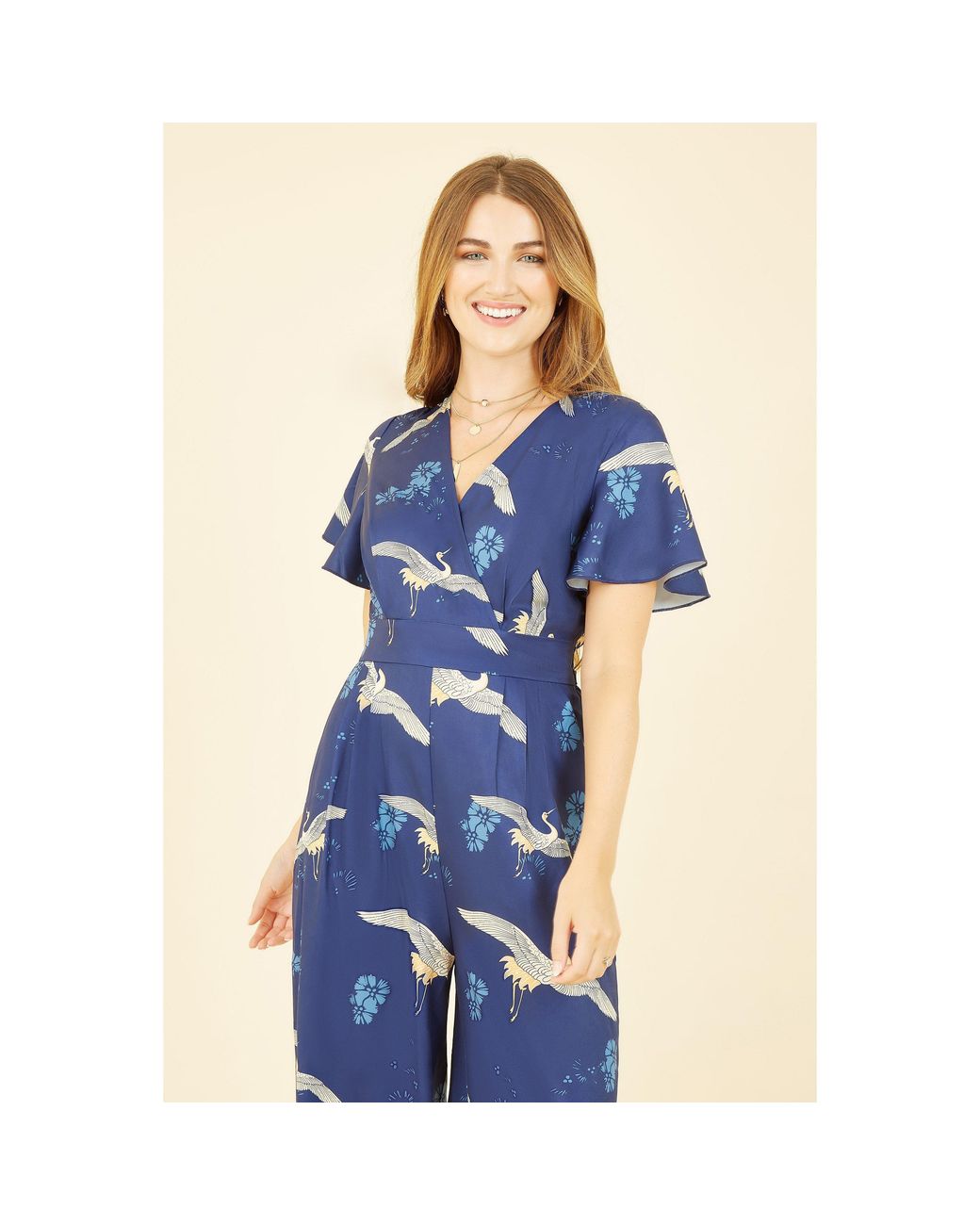 Yumi' Blue Crane Print Angel Sleeve Jumpsuit