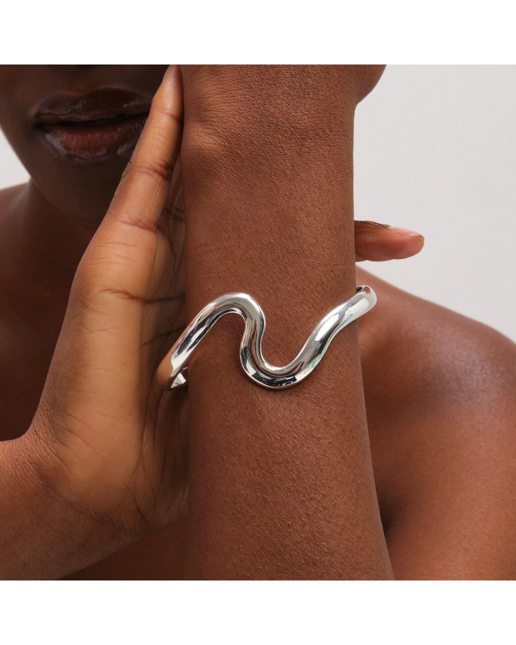 Jon Richard White Plated Polished Swirl Bangle