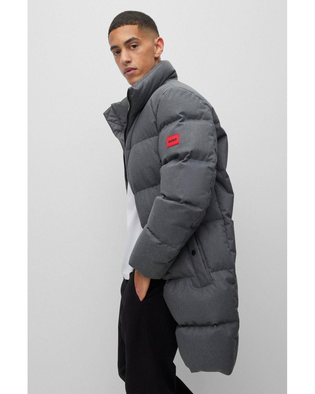 water repellent down puffer coat with red logo label