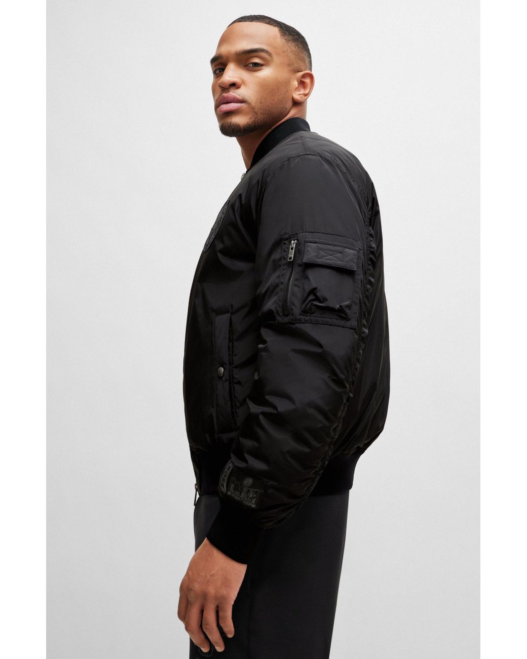 Veste bomber noire à rayures et texte détail bordures côtelées