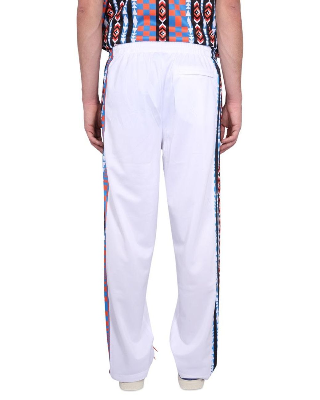Marcelo Burlon Blue Jogging Pants With High Neck And Zipper Closure for men