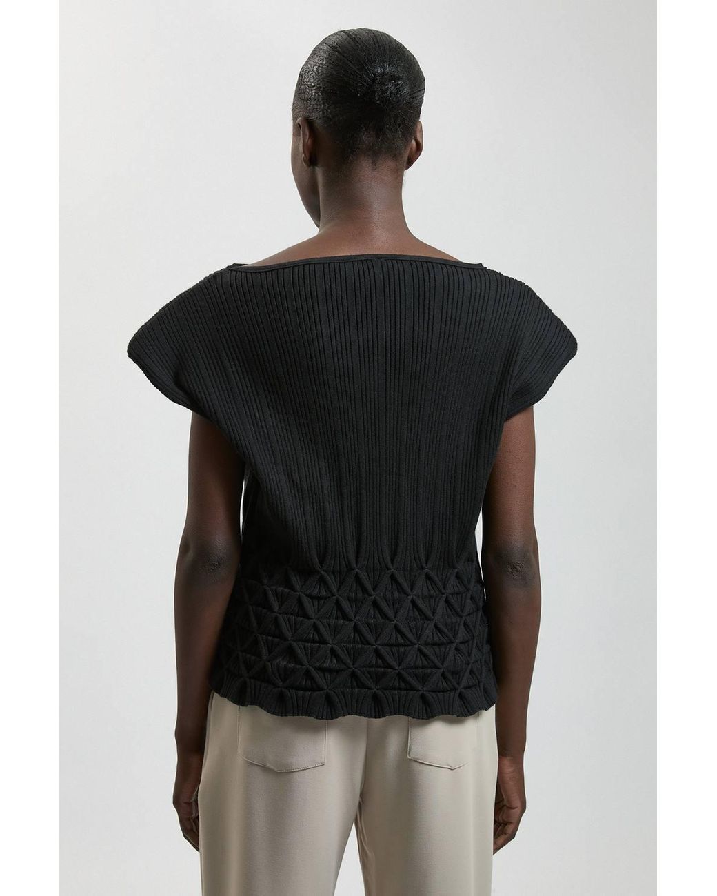 Karen Millen Black Ribbed Knit Power Shoulder Top With Manipulated Stitch Detail